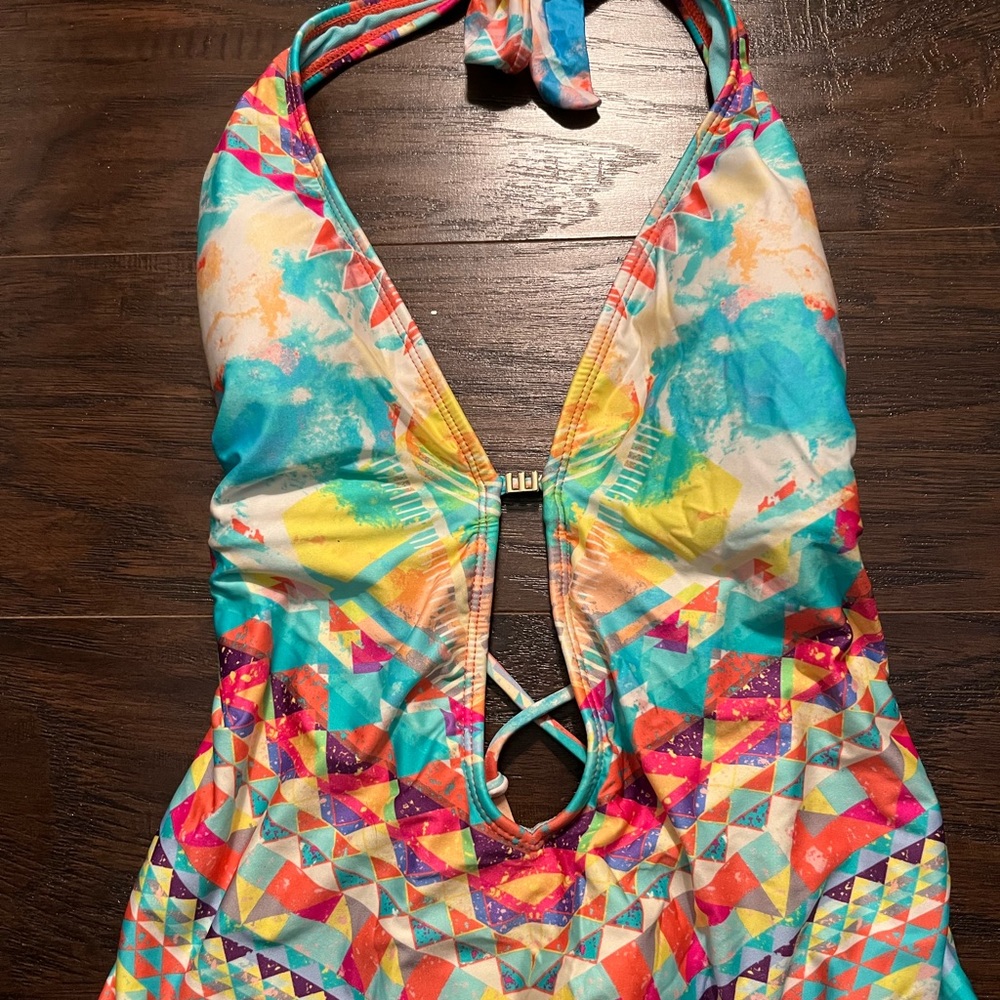 Multi one piece bathing suit. Ties around the next
